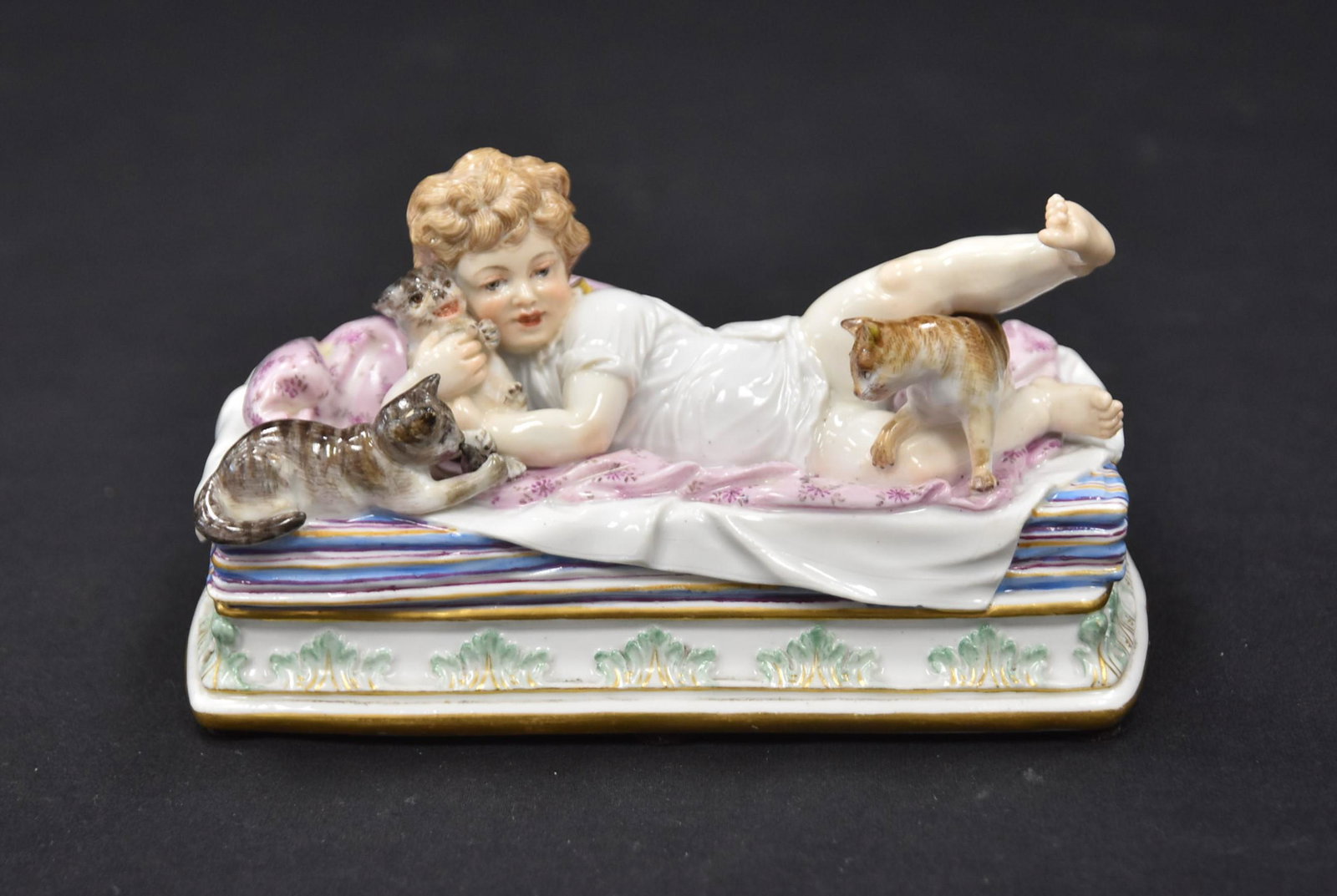 RARE MEISSEN PORCELAIN GIRL & CAT GROUPING: RARE MEISSEN PORCELAIN FIGURAL GROUP OF LITTLE GIRL LAYING IN BED SURROUNDED BY KITTENS , INCISED Model # P148 ; 124 - 6 1/4" x 3 1/2" x 3"