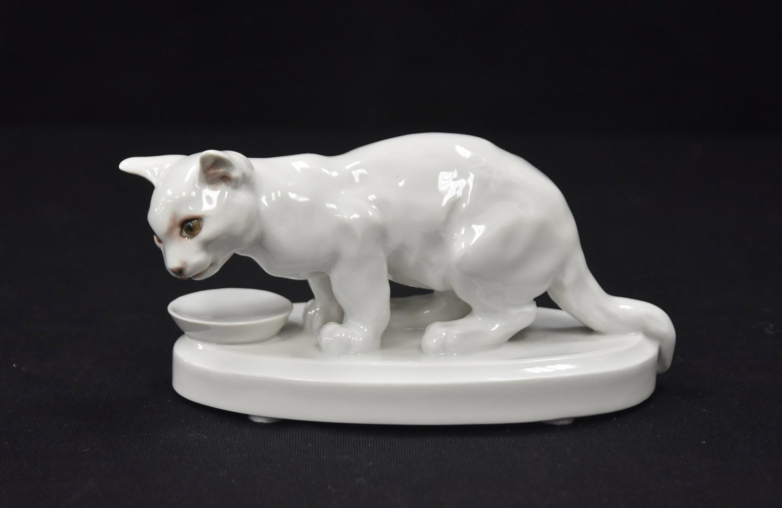 MEISSEN PORCELAIN CAT WITH BOWL: MEISSEN PORCELAIN MODEL OF YOUNG CAT WITH PAINTED EYES , MODEL 78976 , BY ERICH HOSEL - 5 1/2" x 3" x 3"