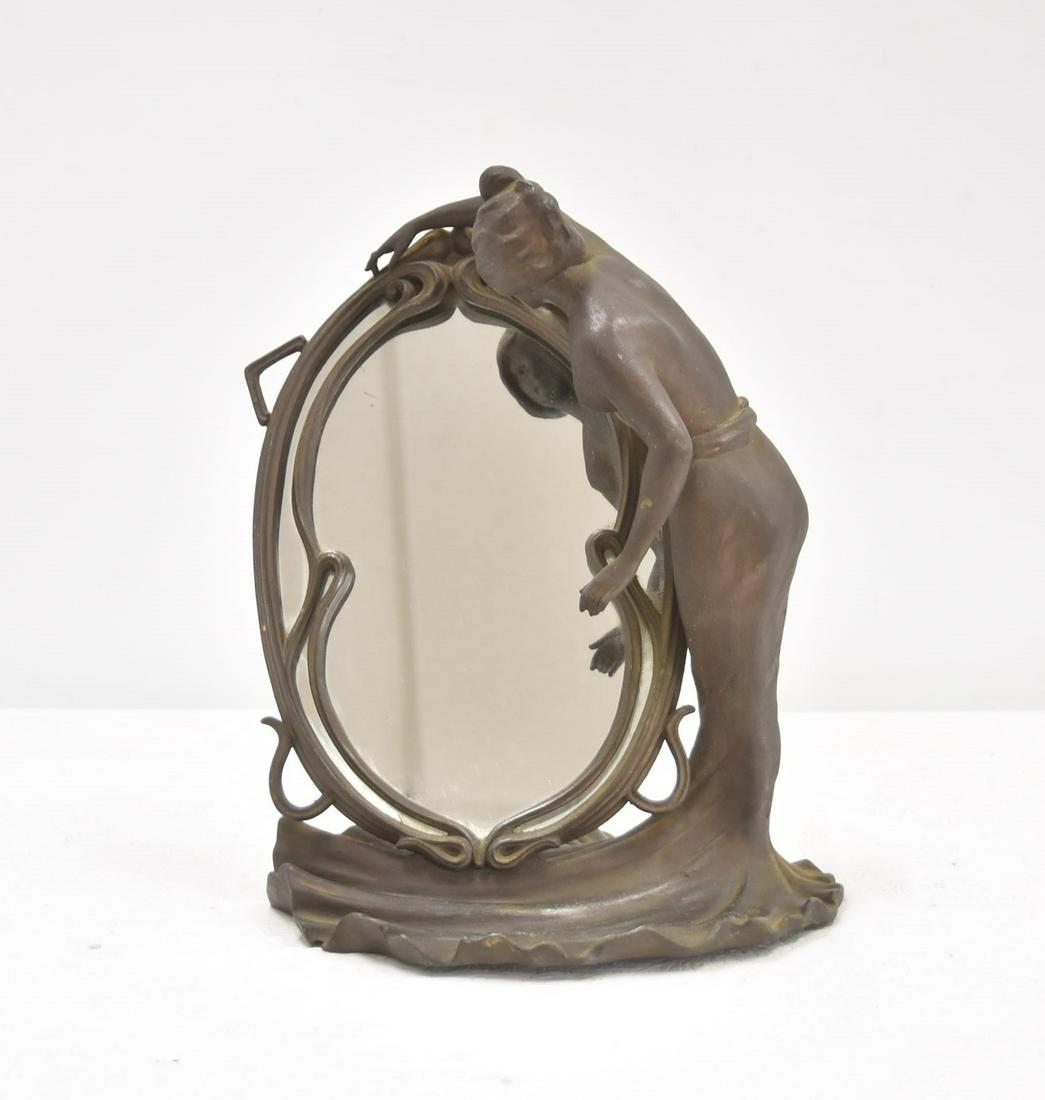 L. GRISARD , ART NOUVEAU VANITY MIRROR: PATINATED METAL ART NOUVEAU TABLE MIRROR DEPICTING FEMALE NUDE STANDING ON SHELL BEFORE MIRROR - 11" x 8" x 13"