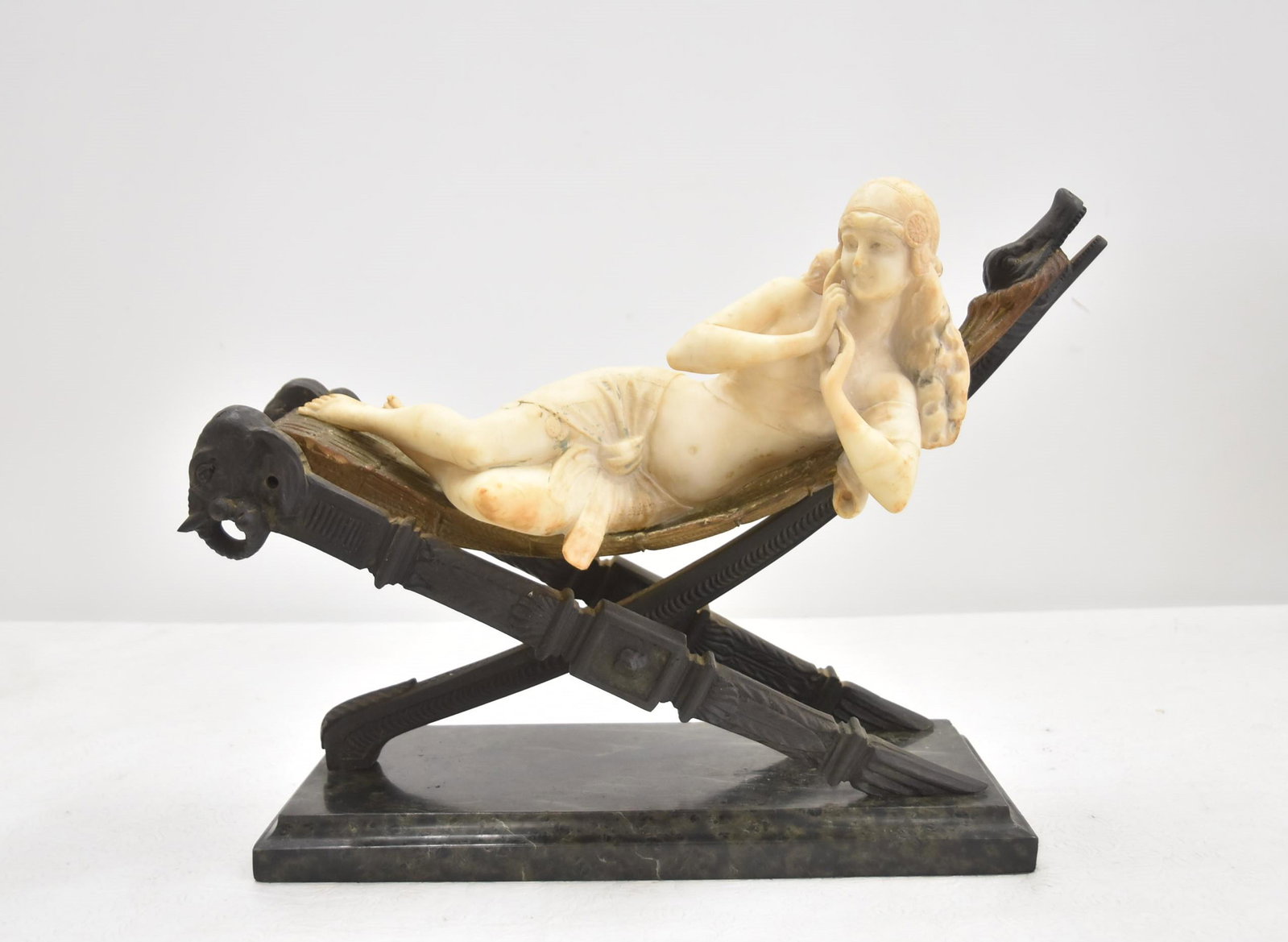 ALABASTER & BRONZE CLEOPATRA SCULPTURE: CARVED ALABASTER CLEOPATRA RECLINING ON BRONZE BENCH WITH ELEPHANT HEADS - 16" x 6" x 12 1/2"