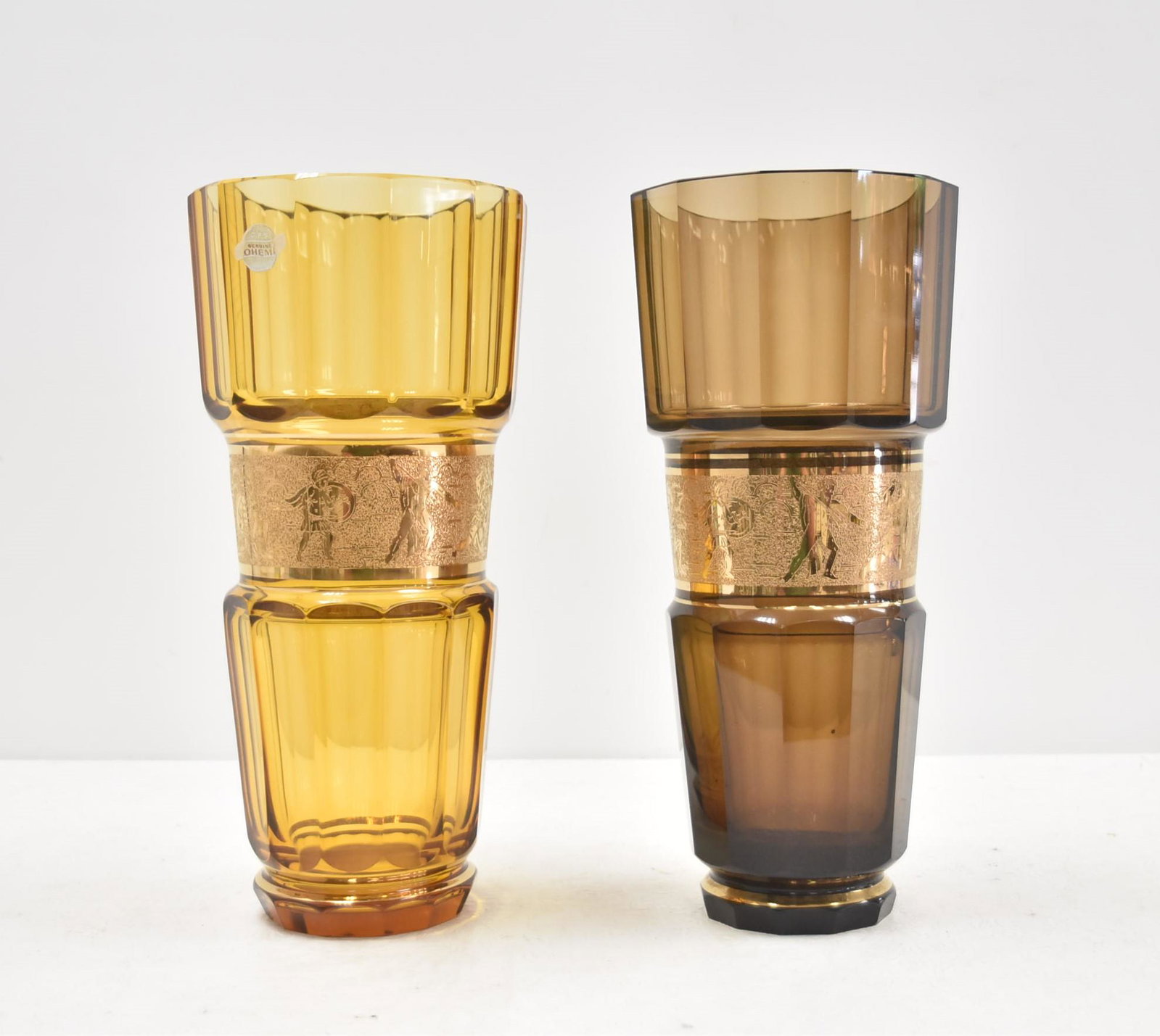 (Pr) MOSER ? ART GLASS VASES WITH FIGURAL BANDS: (2) MOSER ? CZECH ART GLASS VASES WITH FIGURES IN GOLD BAND AROUND VASE - (2) DIFFERENT COLORS - 6 1/2" x 14 1/2"