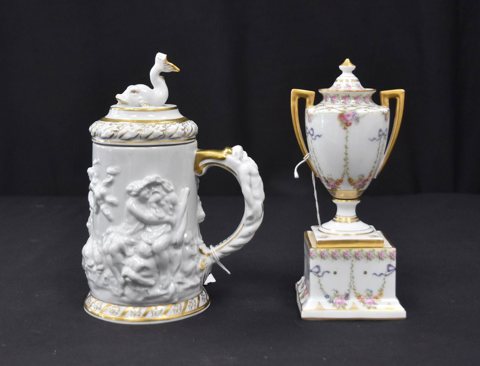 (2) GERMAN PORCELAIN PIECES: ROSENTHAL PORCELAIN TWIN HANDLE COVERED URN WITH FLOWERS & GOLD DECORATIONS - 3 1/2" x 3" x 8" / ERNST BOHNE PORCELAIN STEIN WITH SERPENTS & RAISED RELEIF MYTHOLOGICAL FIGURES - 6" x 4" x 8 1/2"
