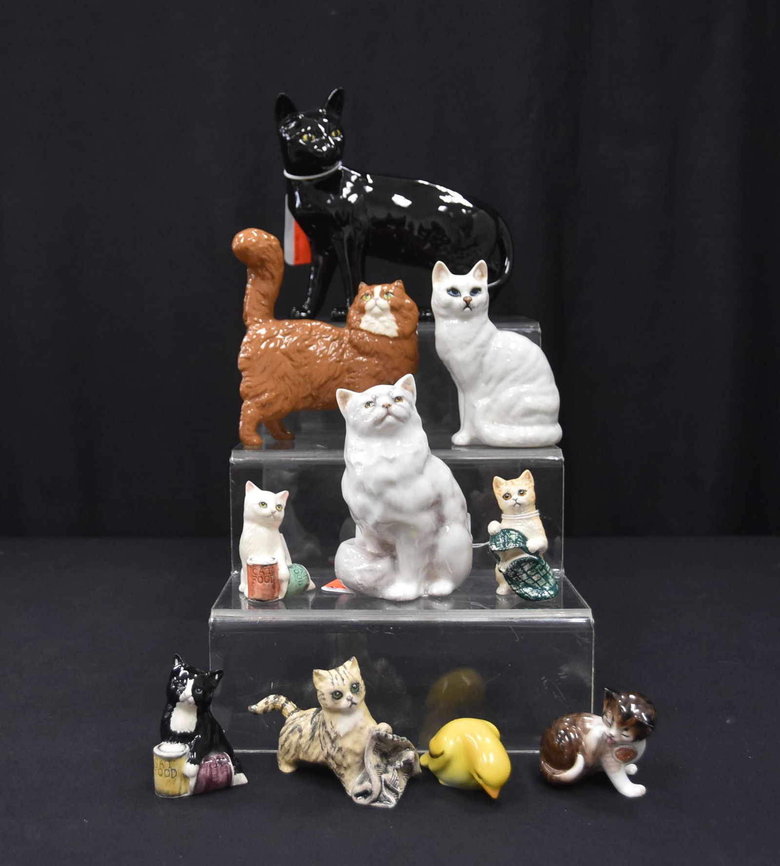 ROYAL DOULTON & BESWICK CATS: ROYAL DOULTON "CAT IN THE NEWS" STRIPED KITTEN WITH NEWSPAPER , (2) ROYAL DOULTON "DINNER TIME" CATS , ROYAL DOULTON BED TIME SLIPPER TABBY CAT - TALLEST IS 2 3/4"ROYAL DOULTON SEATED PERSIAN CAT HN 2