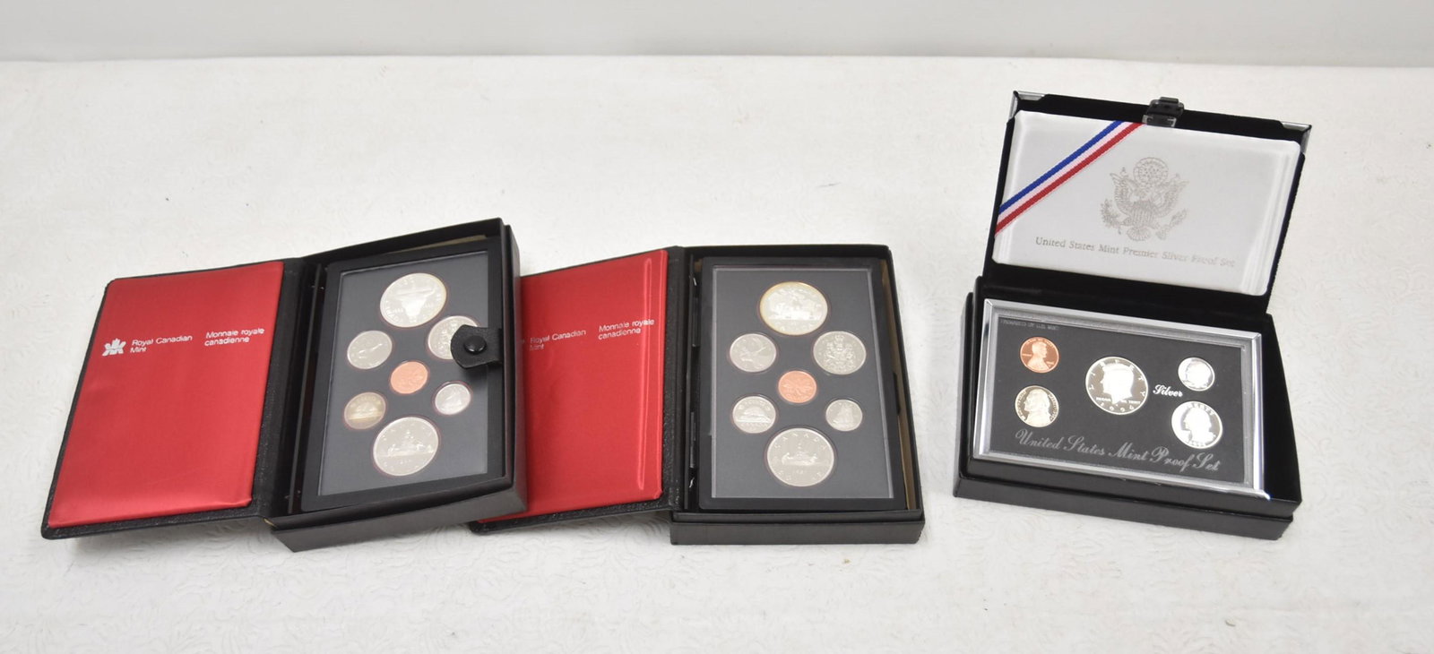 (2) ROYAL CANADIAN (7) COIN PROOF SETS & US SET: (2) ROYAL CANADIAN MINT PROOF SETS WITH (7) COINS EACH / 1996 UNITED STATES US MINT PREMIER SILVER PROOF SET