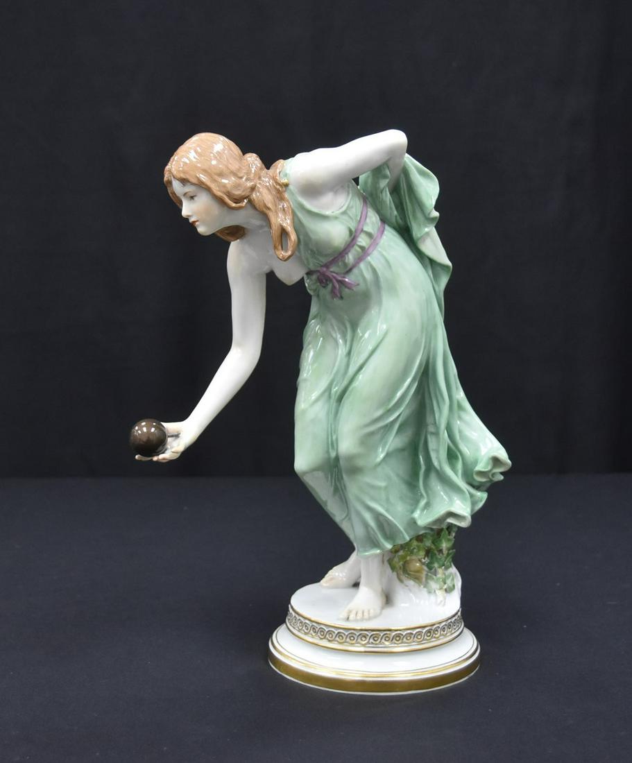 LARGE MEISSEN PORCELAIN GIRL THROWING BALL: WALTER SCHOTT , FOR MEISSEN ,"KUGELSPIELERIN" ca. 1900 , DEPICTING ATLANTA AS YOUNG WOMAN IN CLASSICAL GREEN DRESS THROWING A BALL ON CIRCULAR STEPPED BASE WITH GOLD BAND ; INCISED Q 180 ; AFTER MODEL