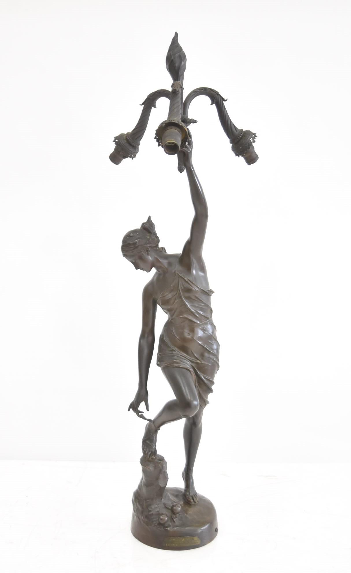 LARGE GEORGE ERNEST SAULO BRONZE FIGURAL LAMP: GEORGE ERNEST SAULO (FRENCH, 1865-1945) LARGE BRONZE WOMAN , TITLED "ATALANTE" , DEPICTING WOMAN IN DRESS HOLDING BRANCH OF (3) LIGHTS , WITH MOUNTED PLAQUE MEDAILLE BEAUX ARTS ; WITH STAMP OF EMILE P