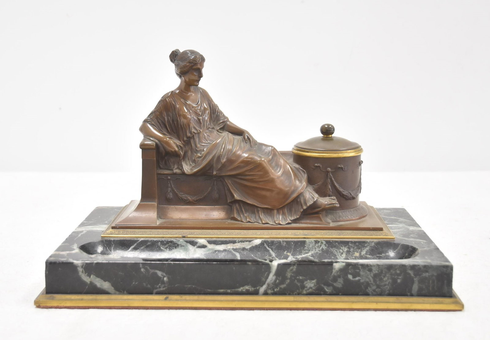 GEORGE JOSEF BURGSTALLER , BRONZE & MARBLE INKWELL: GEORGE JOSEF BURGSTALLER (GERMAN/AUSTRIAN) GRAND TOUR BRONZE NEO CLASSICAL WOMAN RECLINING FORMING INKWELL , SIGNED BURGSTALLER , RAISED ON MARBLE BASE - 12 1/2" x 8" x 8"
