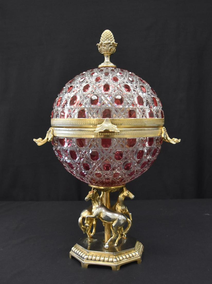 LARGE FABERGE RUBY CUT TO CLEAR CAVIAR SERVER: Fine Faberge Ruby Cut to Clear Czar Alexander Caviar Server. Ornate scroll work to handles with acorn finial, spherical body hinged at the center to display the caviar bowl and carrousel style chevaux