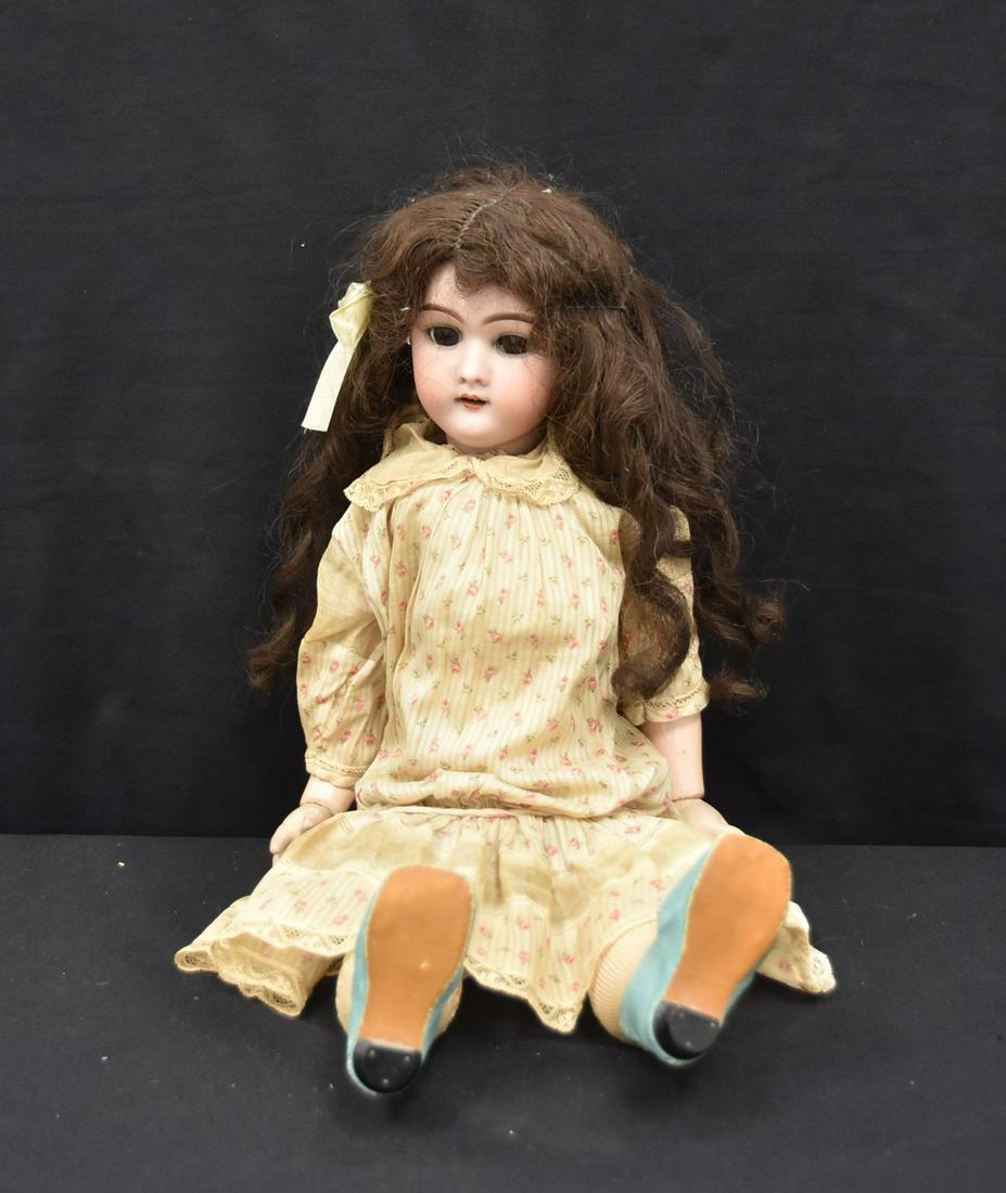 GERMAN HANDWERCK BISQUE HEAD DOLL: HEINRICH HANDWERCK GERMAN BISQUE HEAD DOLL WITH BROWN SLEEP EYES & PIERCED EARS ; 11" CIRCUMFERENCE HEAD ; 22" TALL OVERALL (EYE CRACKED)