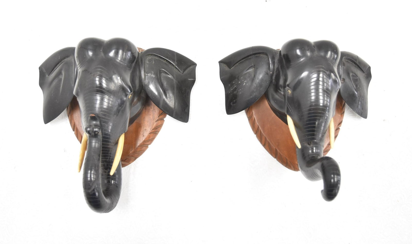 (Pr) CARVED EBONY ELEPHANT WALL BRACKETS: (Pr) CARVED EBONY WOOD ELEPHANT HEAD WALL BRACKET - SHELF MOUNTED ON WOOD - 10 1/2" x 5" x 11" (FEW REPAIRS)