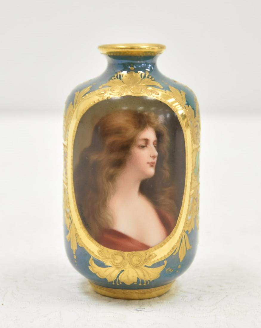 ROYAL VIENNA HAND PAINTED PORCELAIN CABINET VASE: HAND PAINTED ROYAL VIENNA PORCELAIN MINIATURE CABINET VASE WITH PORTRAIT OF WOMAN "REFLECTION" , SURROUNDED BY GOLD DECORATIONS; ARTIST SIGNED WAGNER - 1 1/4" x 3 1/2"