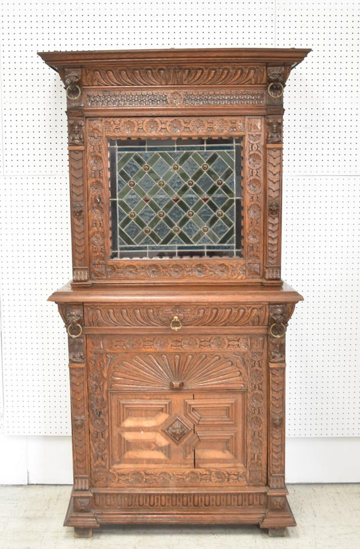 ANTIQUE CARVED OAK & LEADED GLASS CABINET: ANTIQUE CARVED OAK HUTCH WITH LEADED GLASS DOOR & CARVED LION HEADS - 39 1/2" x 19" x 78" (MISSING SOME MOLDINGS)