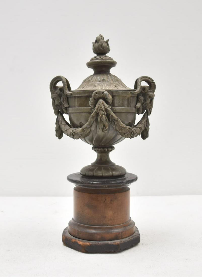SPELTER COVERED URN GARNITURE WITH GARLANDS: RAM HEADS & FLAME FINIAL - 8" x 7 1/2" x 15 1/2"