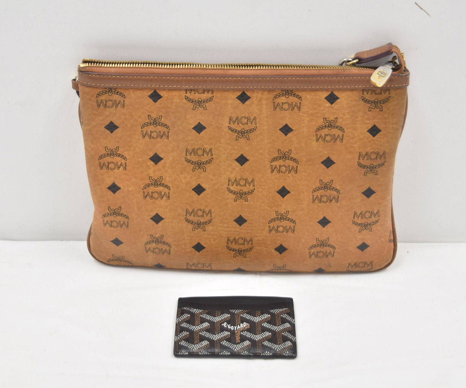 MCM COGNAC POUCH BAG / GOYARD CARD HOLDER: MCM MONOGRAM COGNAC PUCH BAG WITH STRAP - 11 1/2" LONG / GOYARD PARIS SAINT - SULPRICE CARD HOLDER WALLET PURSE