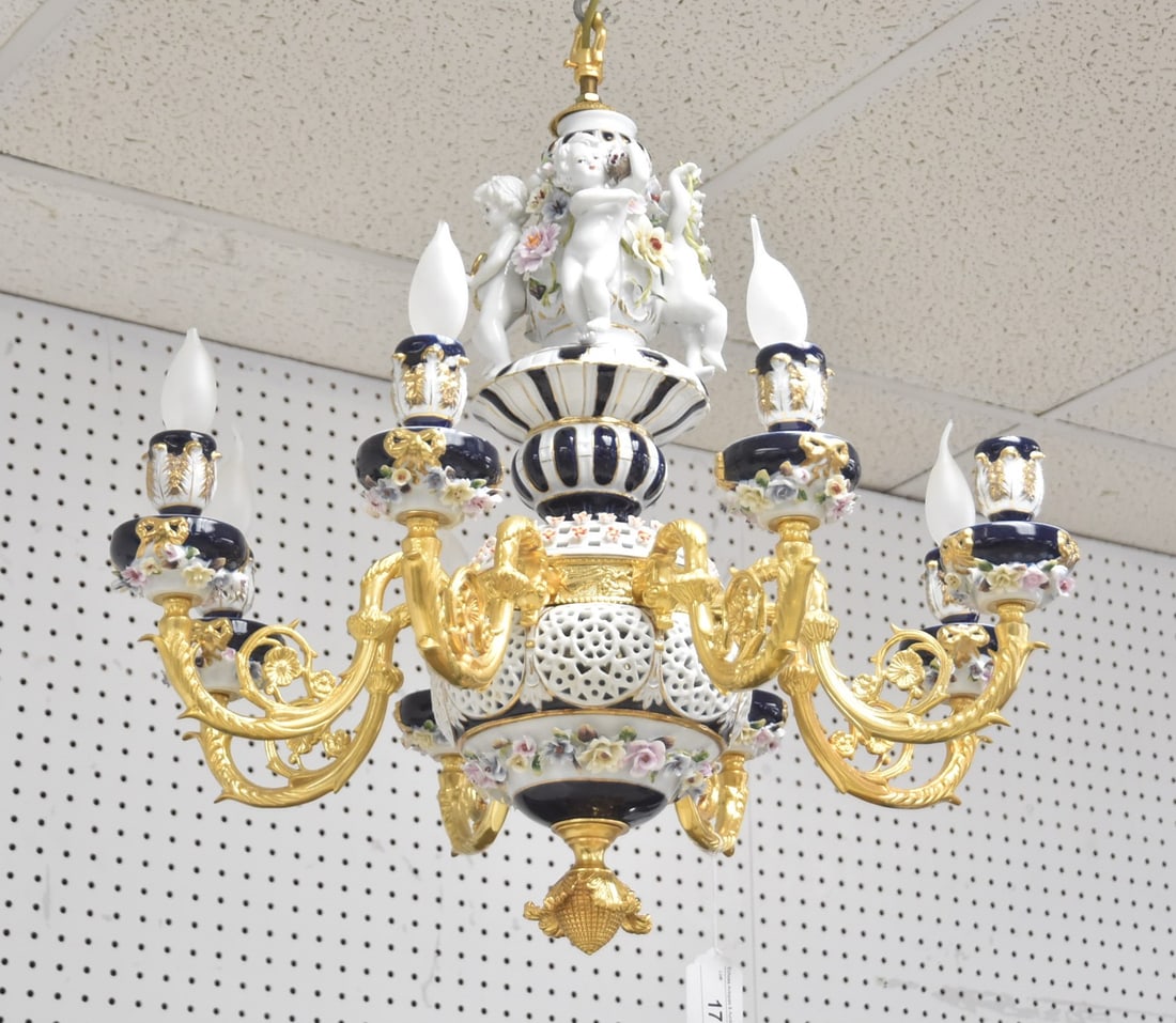 8-LIGHT GILT METAL & PORCELAIN CHANDELIER: 8-LIGHT GILDED METAL & PORCELAIN CHANDELIER WITH 4 PUTTIS SURROUNDED BY ENCRUSTED FLOWERS - 25" x 27"