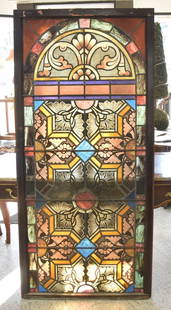 LARGE ANTIQUE STAINED GLASS WINDOW: LARGE ANTIQUE TIFFANY STYLE STAINED LEADED GLASS WINDOW WITH ARCADED & GEOMETRIC DESIGNS - 34" x 72"