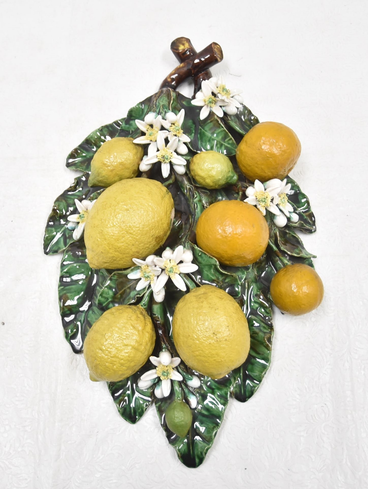 LARGE FRENCH MAJOLICA PALISSY FRUIT PLAQUE: Attributed to Eugène Perret-Gentil à Menton , In the manner of Trompe L’oeil, a French Barbotine , France ca 1880 , The trompe l’oeil wall plaque features the oranges grown on the Côte d’Azur