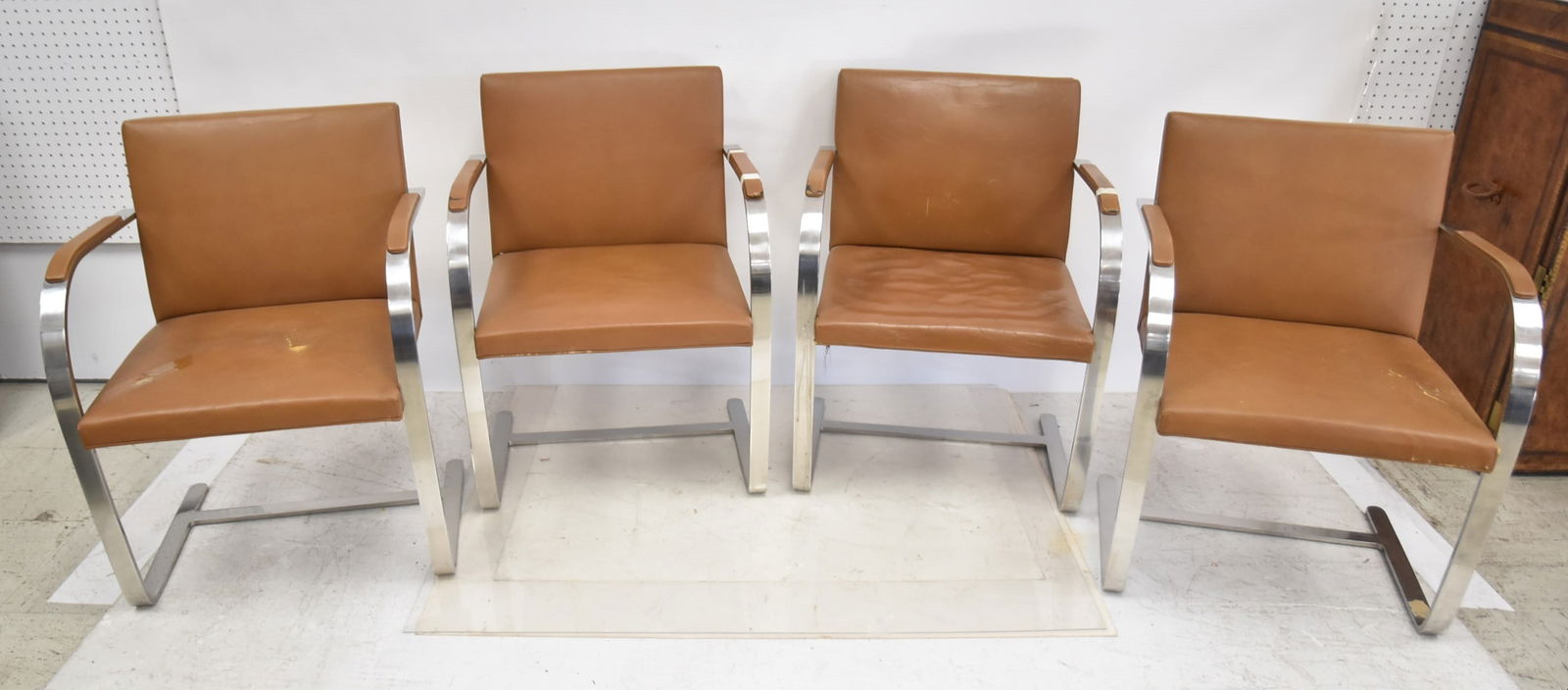 (4) KNOLL INTERNATIONAL CHROME BRNO CHAIRS: (4) MIES VAN DER ROHE FOR KNOLL INTERNATIONAL BRNO CHROME CHAIRS WITH LEATHER UPHOLSTERY (SOME WEAR & LOSS TO LEATHER AND FILLING) - 23" x 23" x 31"