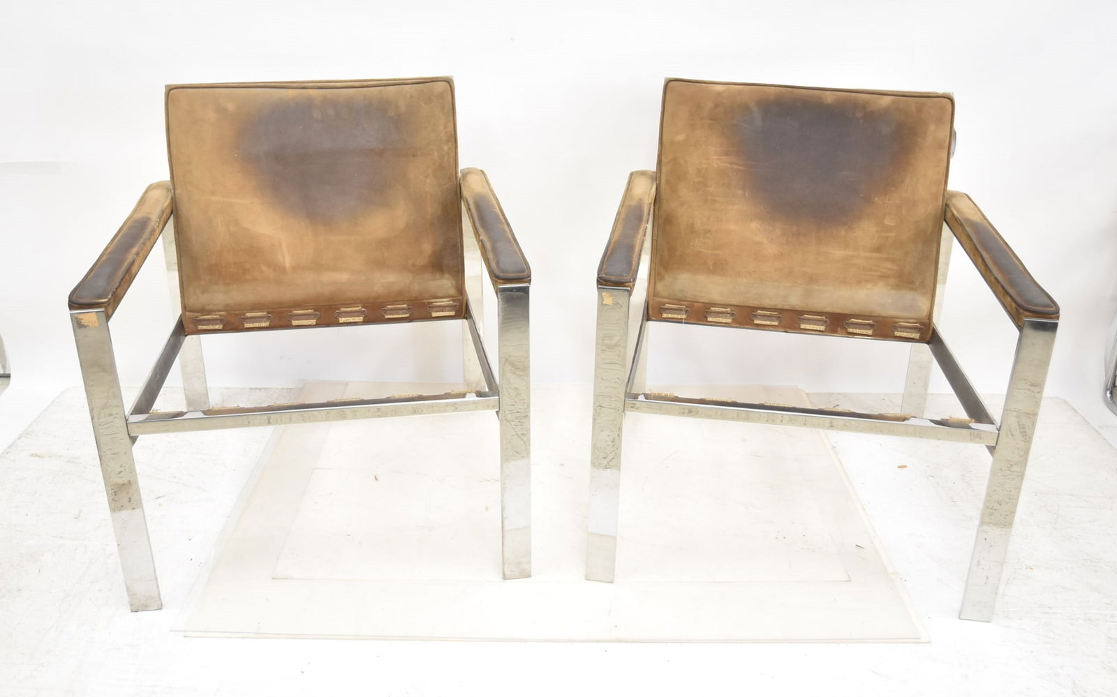 ATTR MILO BAUGHMAN MCM (Pr) CHROME ARM CHAIRS: ATTRIBUTED TO MILO BAUGHMAN MID CENTURY MODERN CHROME AND LEATHER FLAT BAR CHAIRS ; MILO BAUGHMAN STYLE FLAT BAR ARM CHAIRS (NEED UPHOLSTERY) 27 1/2" x 29" x 30"