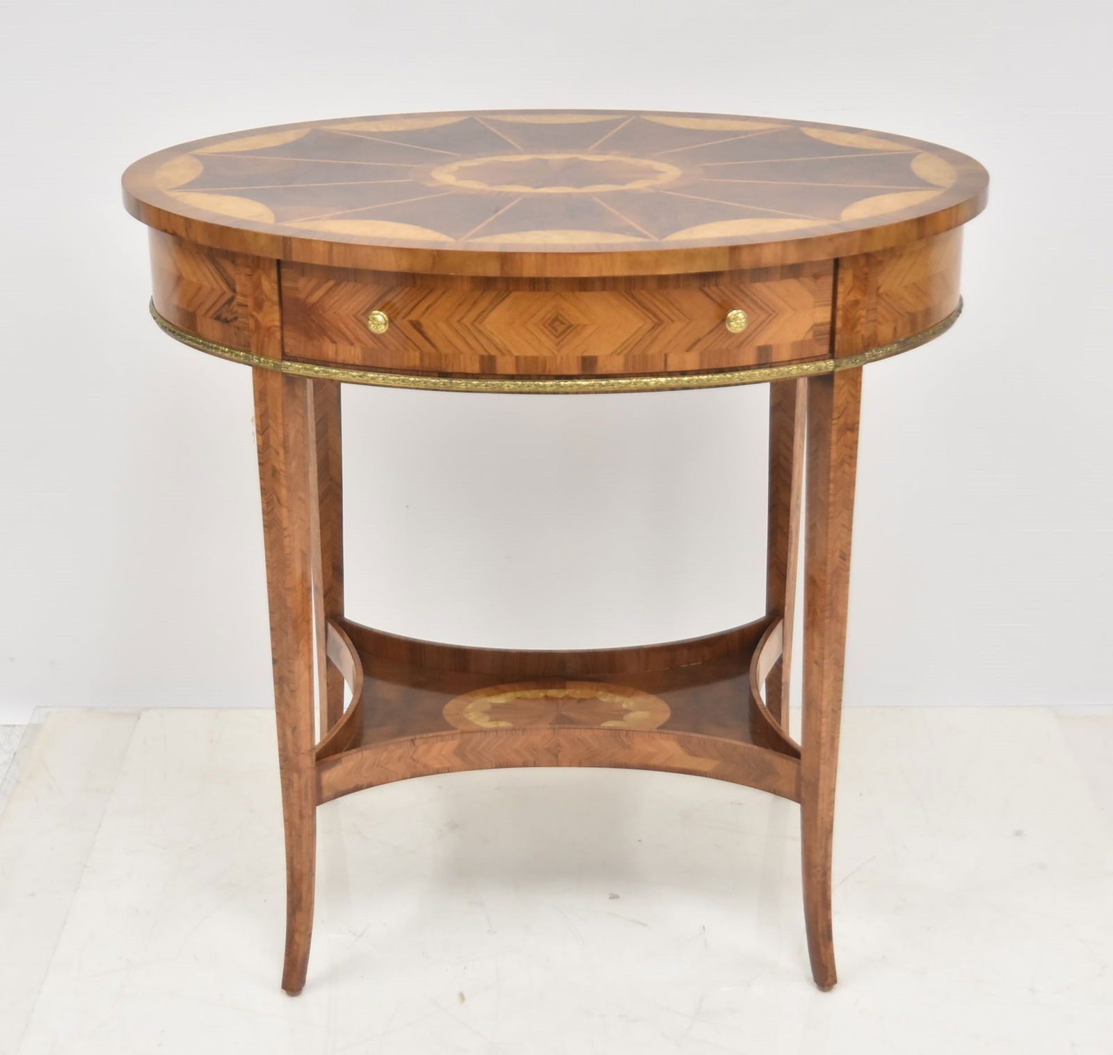 OVAL MAITLAND SMITH OCCASIONAL TABLE: OVAL PARQUETRY INLAID TABLE WITH GALLERY SHELF ON BOTTOM & BRASS TRIM - 29" x 20" x 27 1/2"