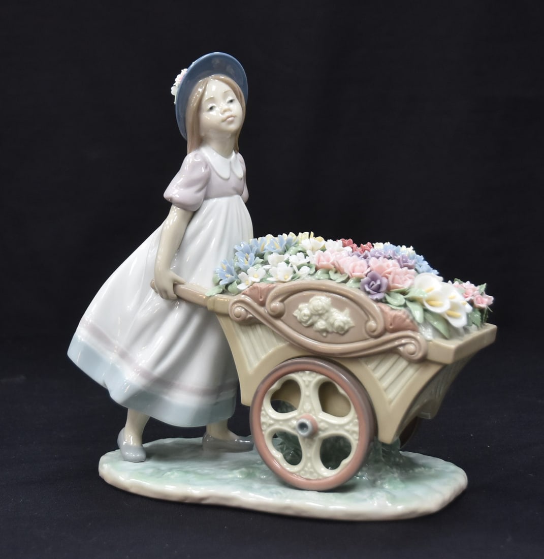 LLADRÓ "LOVE'S TENDER TOKENS": LLADRO MODEL 6521 PORCELAIN FIGURINE OF YOUNG GIRL WITH WHEEL BARROW OF FLOWERS "LOVE'S TENDER TOKEN" , Spanish Name: Con Flores al Mercado , Sculptor: José Puche , ISSUED 1998 , WITH ORIGINAL BOX - 
