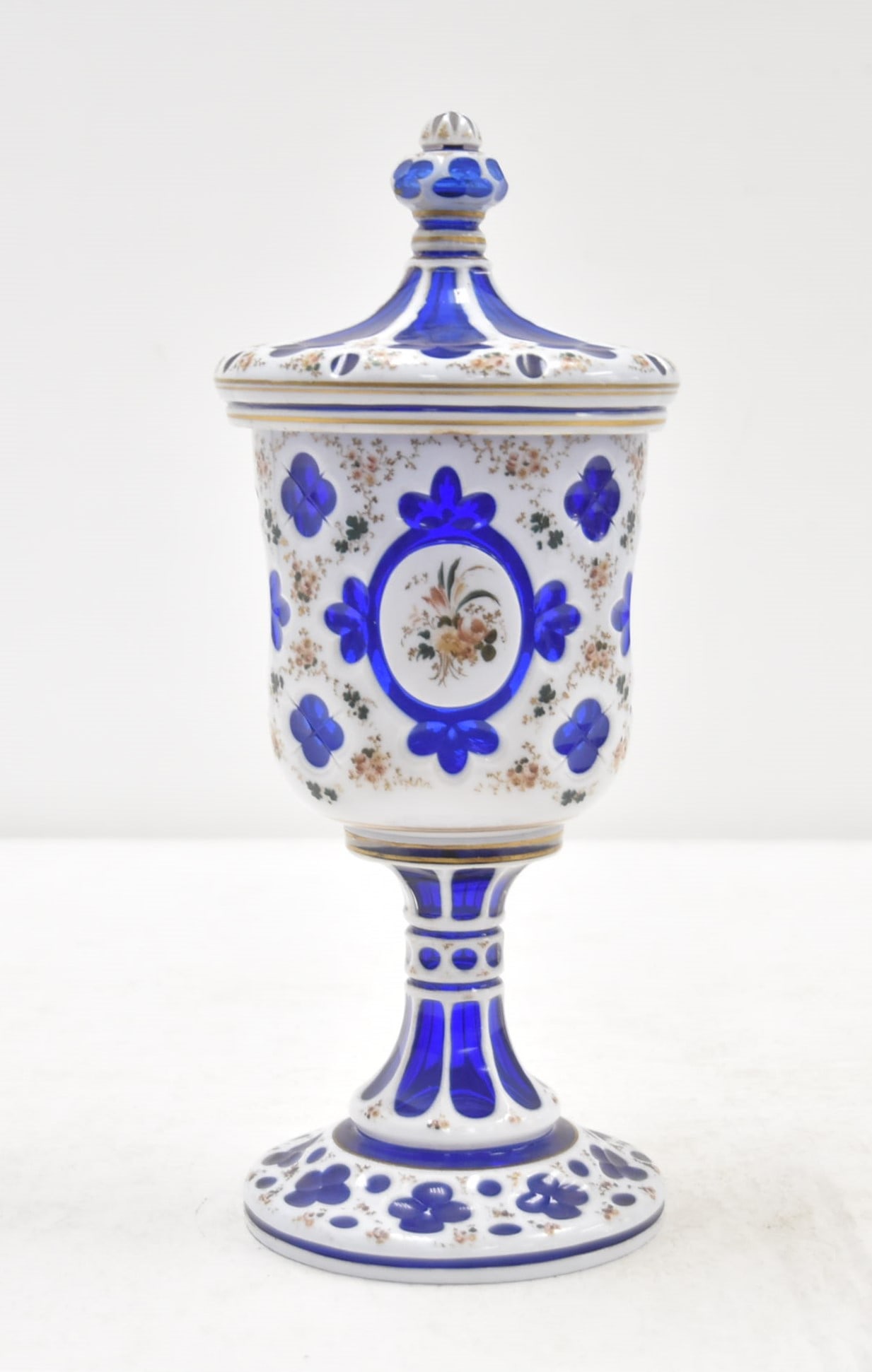BOHEMIAN OVERLAY GLASS POKALE: BOHEMIAN OVERLAY GLASS COVERED POKALE WITH HAND PAINTED FLOWERS - 4 1/2" x 10 1/2"