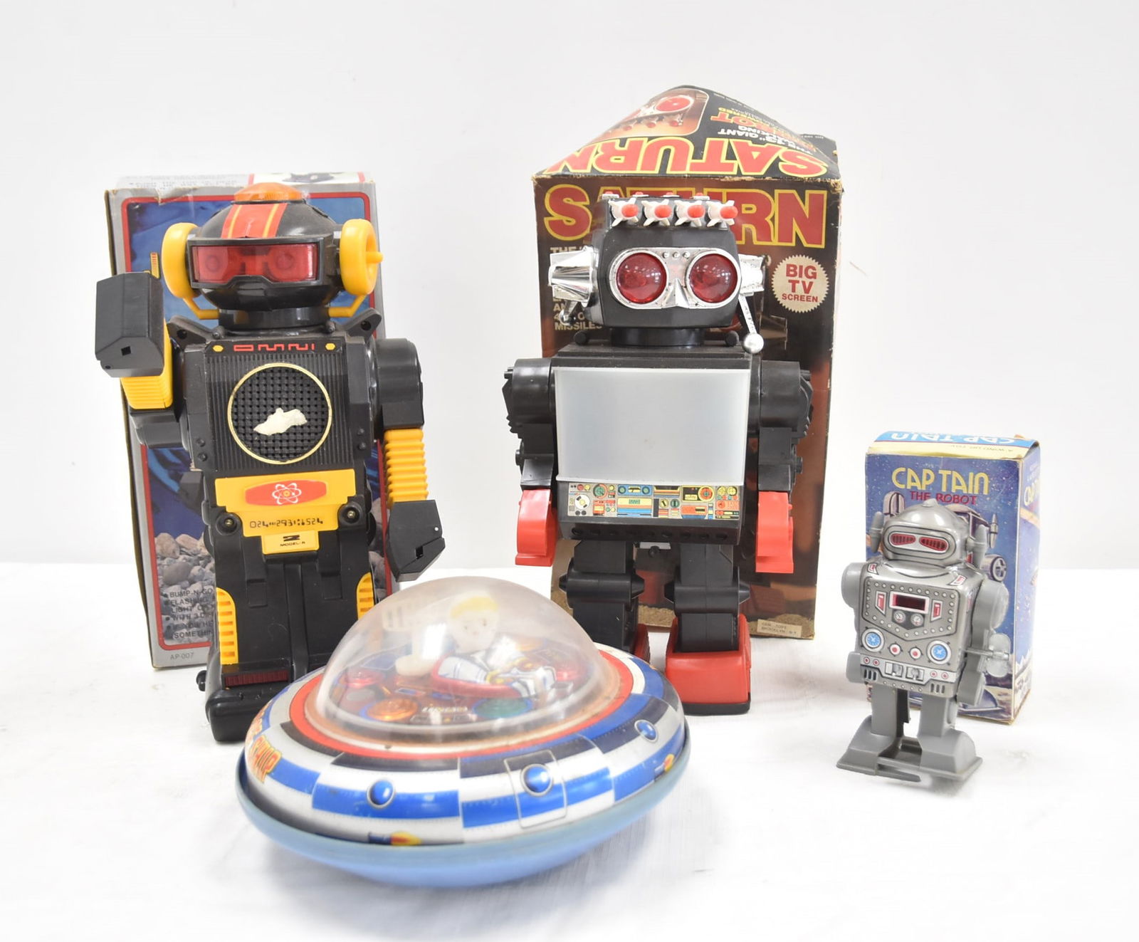 (4) VINTAGE TOY ROBOTS & SPACESHIP: VINTAGE TAIWAN SPACE SHIP X-5 / VINTAGE SATURN ROBOT KAMCO NO 1981 BIG TV BATTERY OPERATED / Captain The Robot Vintage Wind Up Walking Robot Toy MTU Korea Tin Toy / VINTAGE JOHN ROBOT BATTERY OPERATED
