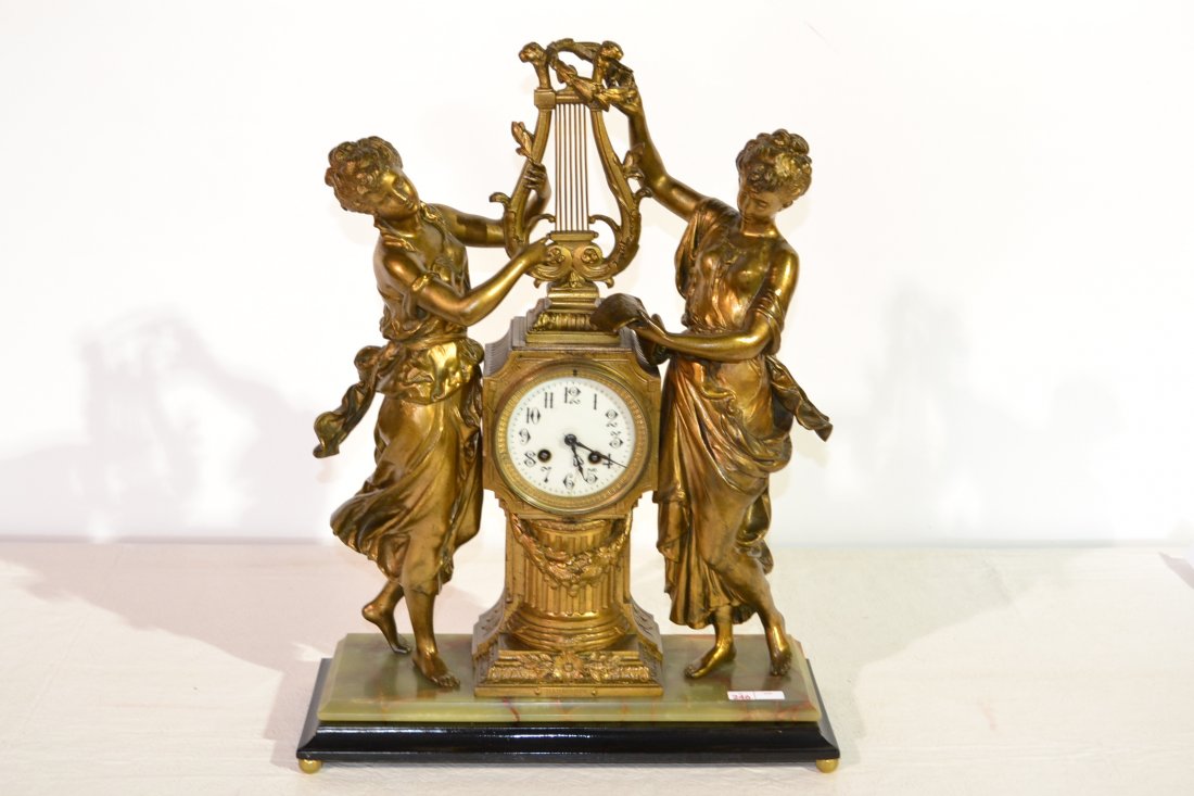 FRENCH GILT METAL DOUBLE FIGURAL MANTLE CLOCK: WITH LYRE ON ONYX BASE INSCRIBED HARMONIE MOREAU - 16 1/2" x 6 1/2" x 22" (IN WORKING ORDER)