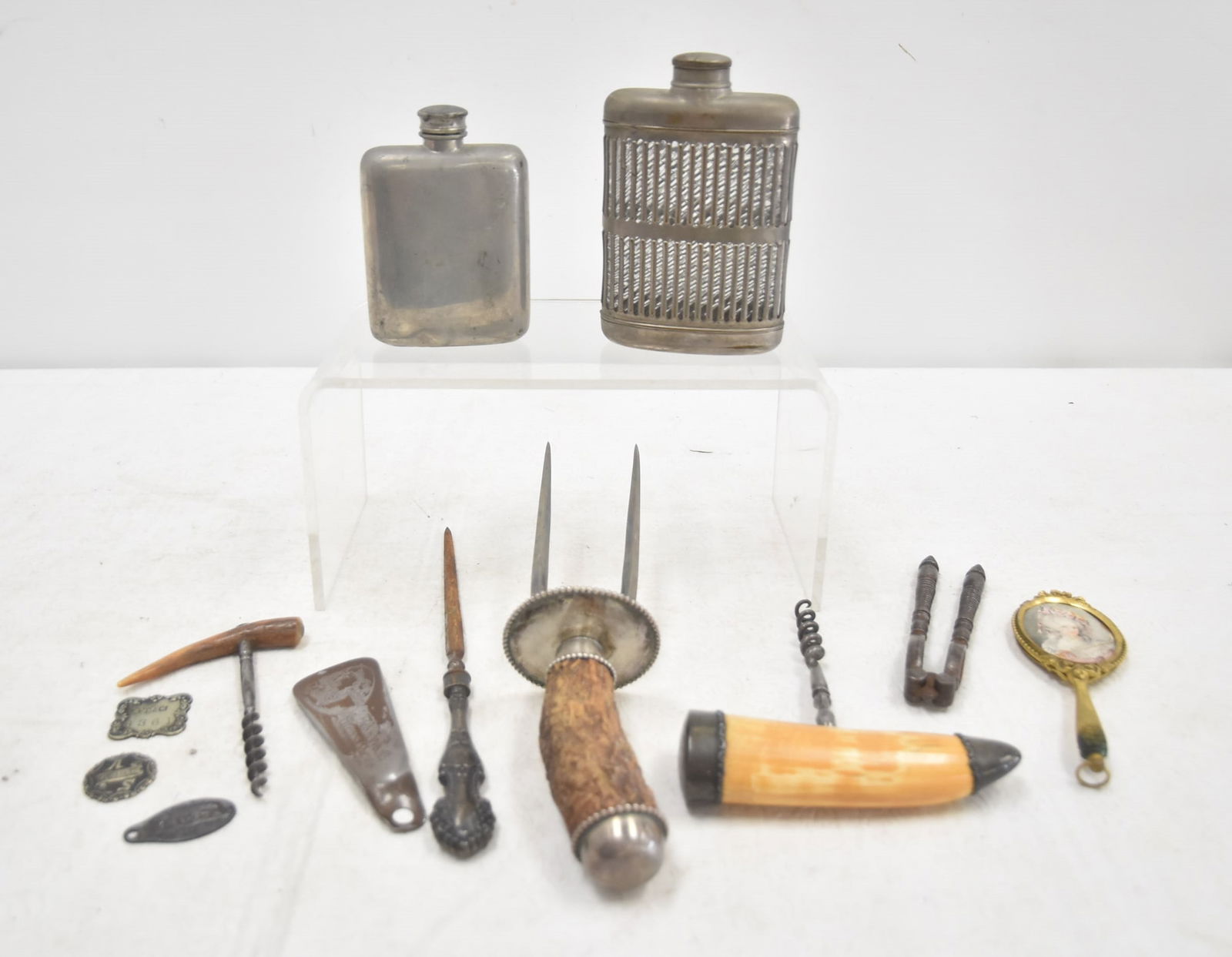 ANTIQUE CARVING PIECES / CORKSCREWS & FLASKS: STERLING SILVER MOUNTED STAG HANDLE FORK / (2) SILVER PLATED FLASKS / NUTCRACKER / STERLING HANDLE FILE / (2) BONE HANDLE CORK SCREWS / JOHN WARD SHOE HORN / (3) TAGS - LARGEST PIECE IS 11"