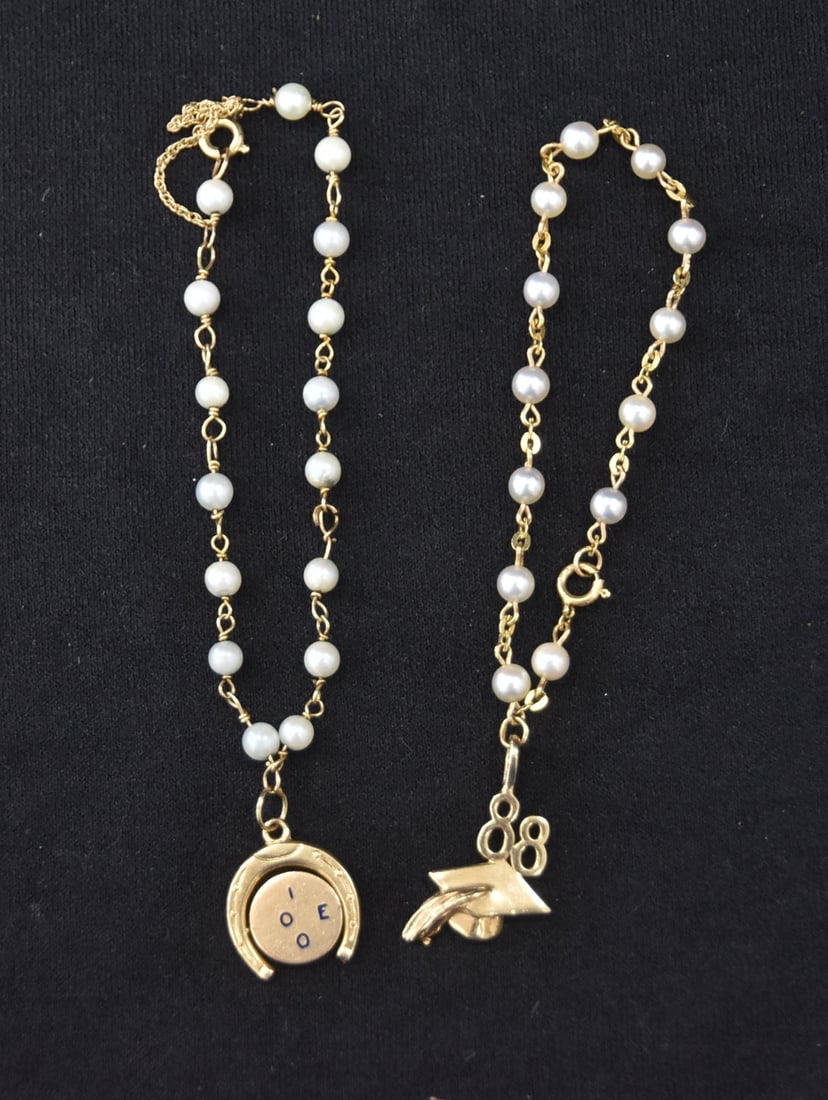 (2) 14kt GOLD & PEARL CHARM BRACELETS: 14kt GOLD & PEARL BRACELET WITH 14kt I LOVE YOU SPINNING CHARM / 14kt GOLD & PEARL BRACELET WITH 14kt GOLD 88' GRADUATION CHARM - 10.2grams GROSSthe approx length without the charm is 3" ; 4" overall