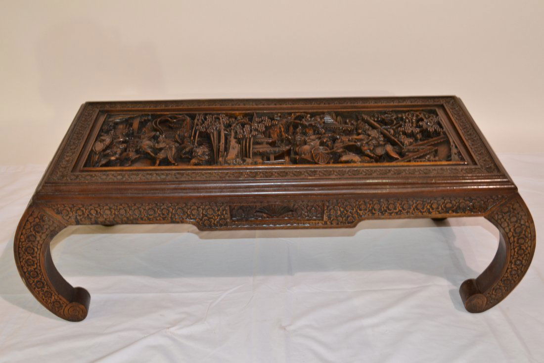 HEAVILY CARVED GLASS TOP COFFEE TABLE WITH: ORIENTAL FIGURES , PAGODAS , HORSE & CHARRIOT WITH DRAWER - 16" x 40" x 14"
