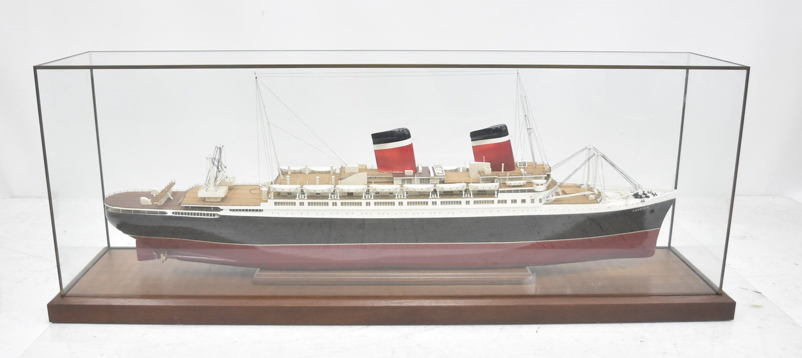 SS AMERICA OCEAN LINER SHIP MODEL: FINELY DETAILED HAND MADE LARGE SS AMERICA OCEAN LINER SHIP MODEL ; SHIP IS 48" LONG ; OVER IN GLASS DISPLAY CASE - 52" x 11 1/2" x 19 1/4"