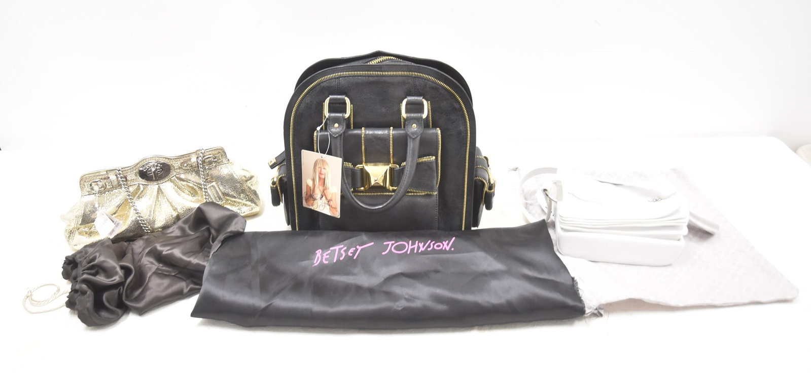 (3) DESIGNER HAND BAGS: BETSEY JOHNSON VINTAGE LOOP DE LOOP BOWLING BAG - 12" x 6" x 12" (BRAND NEW) / COACH TEXTURED GOLD TONE BAG - BRAND NEW / BODHI WHITE LEATHER TEMPLE BAG PURSE - BRAND NEW HANDBAG -
