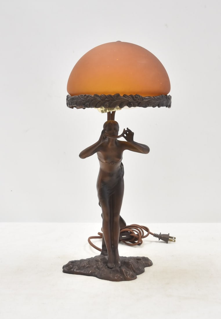 ERICH SCHMIDT KESTNER BRONZE ART DECO FIGURAL LAMP: ERICH SCHMIDT KESTNER (GERMAN, 1877-1941) GERMAN ART DECO BRONZE FIGURAL LAMP , DEPICTING FEMALE NUDE HOLDING LEAF WITH ORANGE ART GLASS DOME SHADE , SIGNED S KESTNER FEC - 8" x 20"