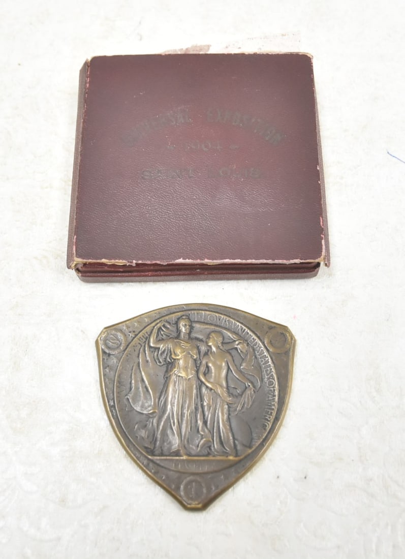 Commemorative Medal of the Louisiana Purchase Exposition: Commemorative Medal of the Louisiana Purchase Exposition 1904, Triangular, bronze, 70mm., by Weinberg, Louisiana cloaking Indian maiden, reverse Eagle with outspread wings on panel with award legend T