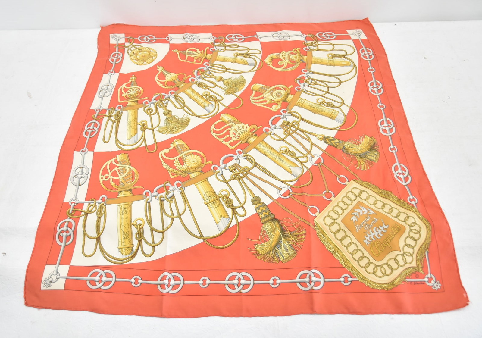 HERMES "CLIQUETIS" SILK SCARF: HERMES "CLIQUETIS" SILK SCARF , ARTIST J. ABADIE- 33" x 35 1/2" (FEW STAINS & FRAYING)