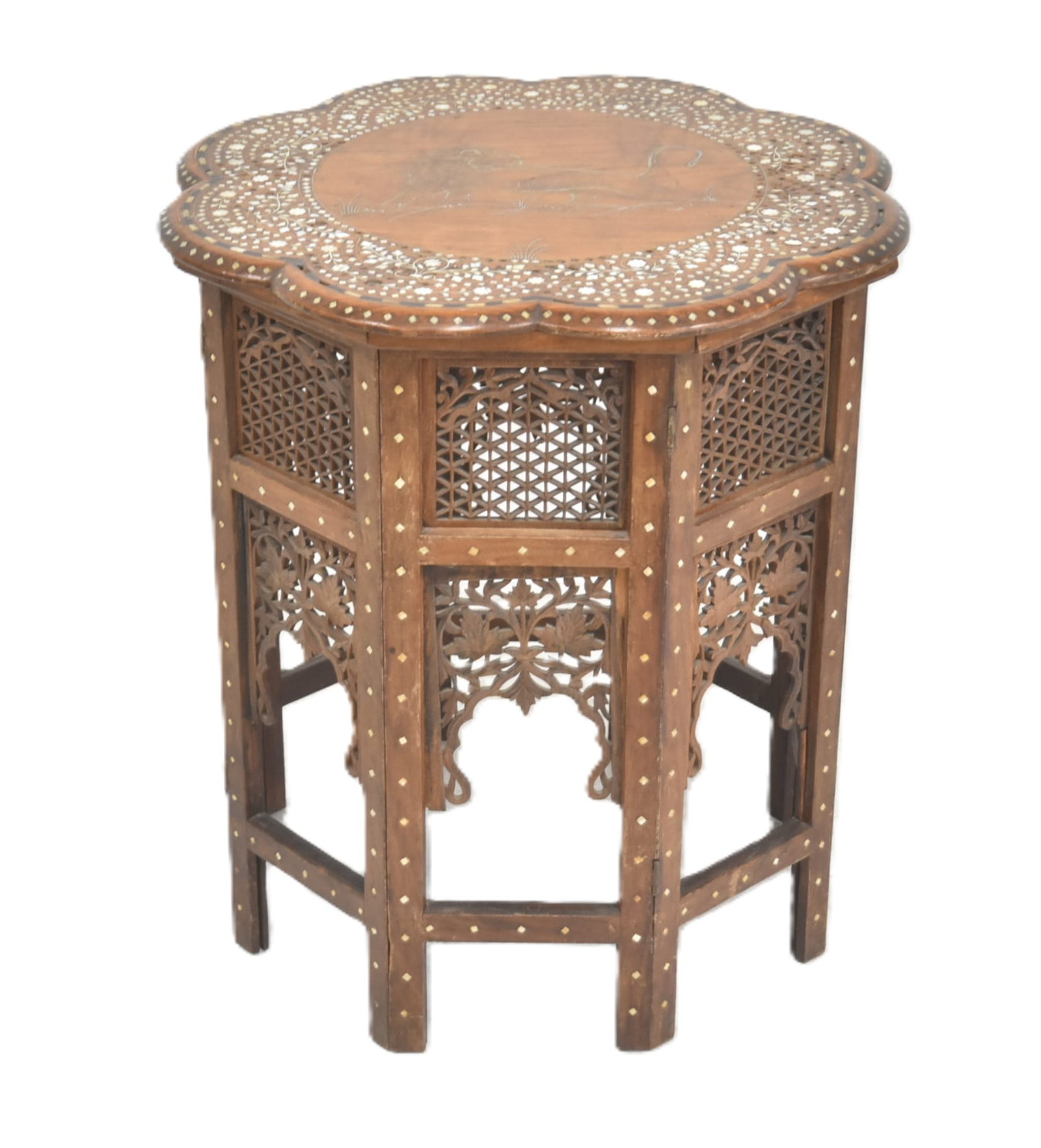 ANGLO INDIAN CARVED TEAK FOLDING TABLE: ANGLO INDIAN HEXAGONAL FOLDING CARVED TEAK TABLE WITH BONE INLAID TIGER ; MARKED MADE IN INDIA - 20" x 22"