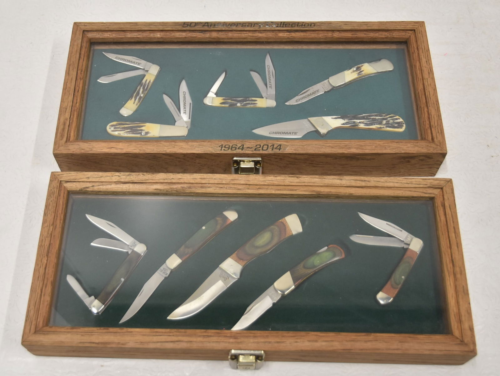 (2) INCASED BEAR POCKET KNIFE SETS: 50th ANNIVERSARY CHROMATE BEAR MGC HUNTING POCKET KNIVES WITH STAG HANDLES ; SET IN PRESENTATION CASE ; 50th ANNIVERSARY (1964-2014) / (5) BEAR ,GC HUNTING KNIFE COLLECTION & (1) CLARK CUT POCKET KNIF