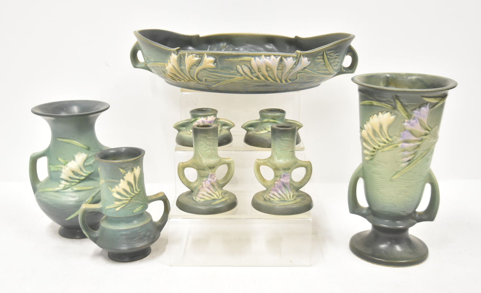 ROSEVILLE "FREESIA" POTTERY GROUPING: ROSEVILLE POTTERY "FREESIA" PATTERN GROUPING CONSISTING OF (3) ROSEVILLE FREESIA VASES - LARGEST IS 5 /2" x 10 1/2" / (2) PAIR OF ROSEVILLE FREESIA CANDLESTICKS / ROSEVILLE FREESIA CENTERBOWL - 15" x