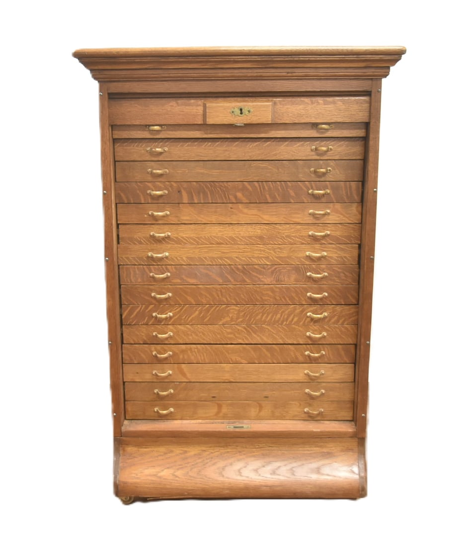 ANTIQUE OAK TAMBOUR MAP CASE: ANTIQUE OAK MAP OR PRINTERS CASE WITH (15) DRAWERS & TAMBOUR LOCKING SCROLL TOP - 28" x 29" x 43" (FINISH DAMAGE ON TOP)