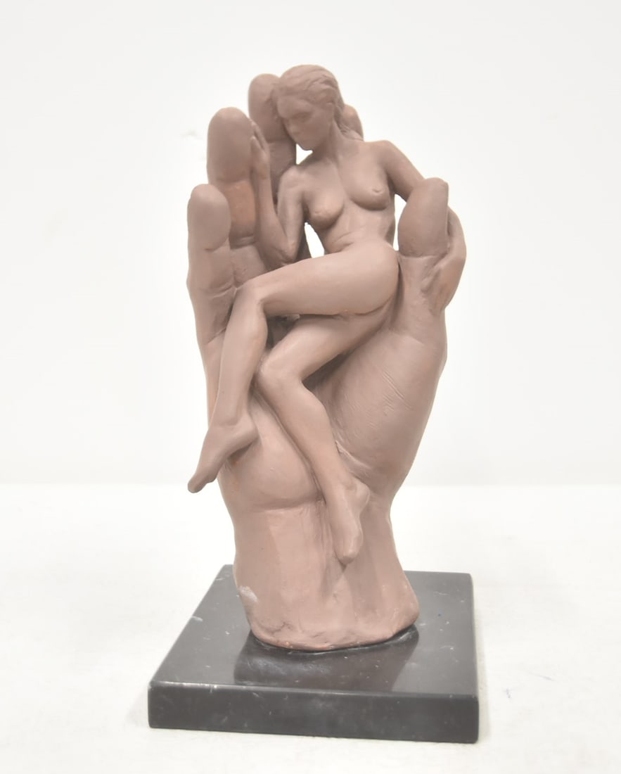 GARY MIRABELLE TERRACOTTA COMPASION SCULPTURE: GARY MIRABELLE TERRACOTTA COMPASSION DEPICTING FEMALE NUDE RECLINING INSIDE HAND - 11" TALL