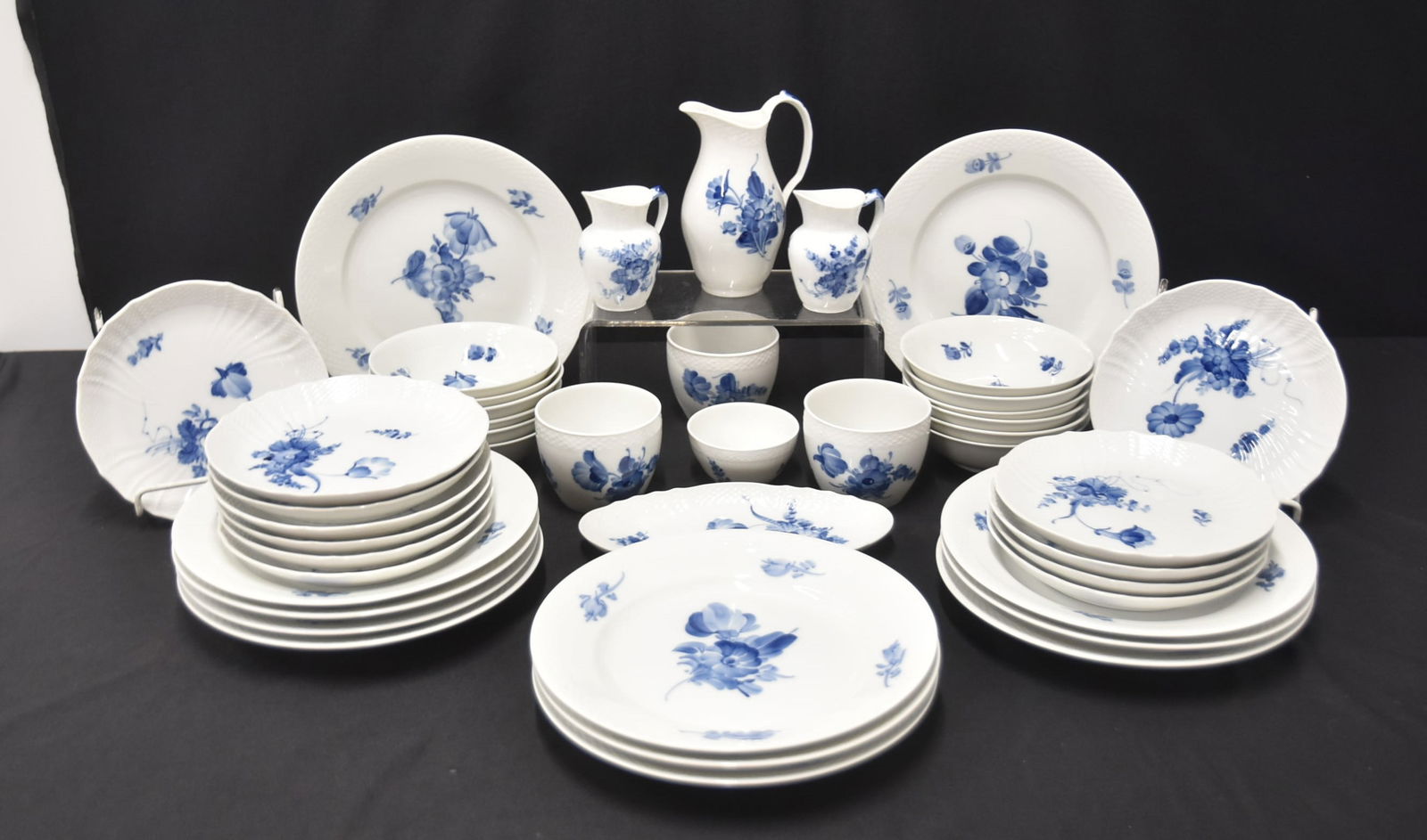 ROYAL COPENHAGEN "BLUE FLOWERS" DINNER SET: BLUE FLOWERS PATTERN ROYAL COPENHAGEN PORCELAIN DINNER SET CONSISTING OF (12) DINNER PLATES - 10 1/4" , (12) BOWLS (ONE CHIP) , (11) CAKE PLATES , (3) PITCHERS , (4) CUPS & BREAD TRAY