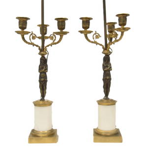 (Pr) EGYPTIAN REVIVAL BRONZE CANDELABRAS: PAIR ANTIQUE BRONZE EGYPTIAN REVIVAL CANDELABRA LAMPS WITH ANCIENT EGYPTIAN FIGURES HOLDING 3-ARM CANDELABRA LAMPS - 7" x 7" x 25 1/2"