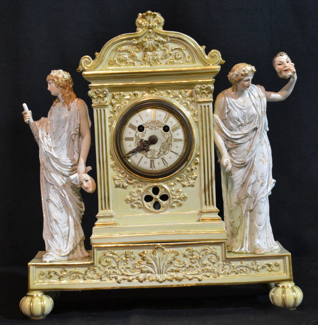 19thC DOUBLE FIGURAL MEISSEN MANTLE CLOCK: DEPICTING (2) GRECIAN FIGURES HOLDING THEATRE MASKS & STAFF ON EITHER SIDE WITH GUSTAV BECKER MOVEMENT RAISED ON (4) BALL FEET ; HAS BLUE CROSSED SWORDS MARK & INCISED 101- 13 , 818 - 13 1/2" x 6" x 1