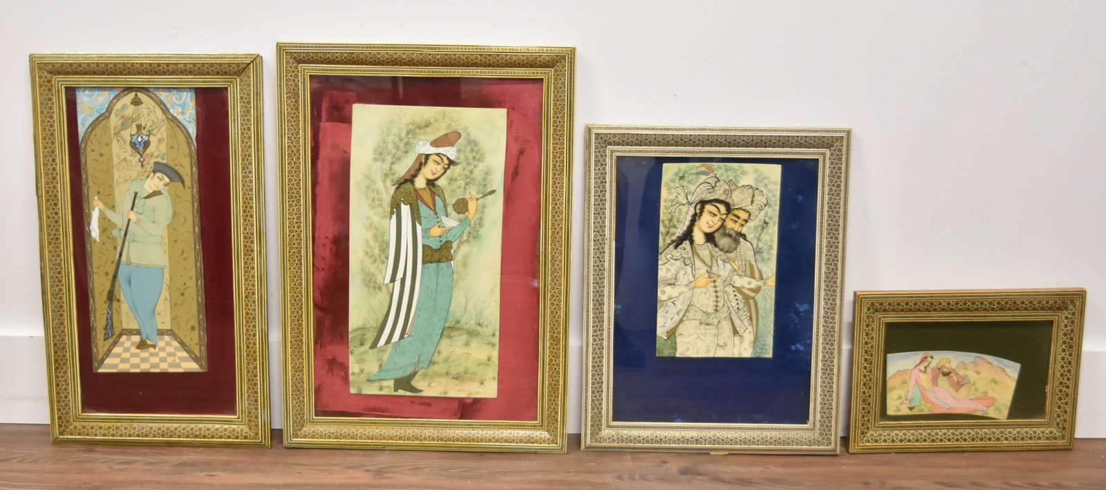 (4) PERSIAN PAINTINGS IN KHATAM FRAMES: (4) PERSIAN MINIATURE PAINTINGS ON CELLULOID , ARTIST SIGNED , SET IN KHATAM BONE INLAID FRAMES - SMALLEST IS 9 1/2' x 13 1/2" OVERALL ; LARGEST IS 16" x 23" ; PERSIAN MINIATURE PAINTINGS ; KHATAM PER