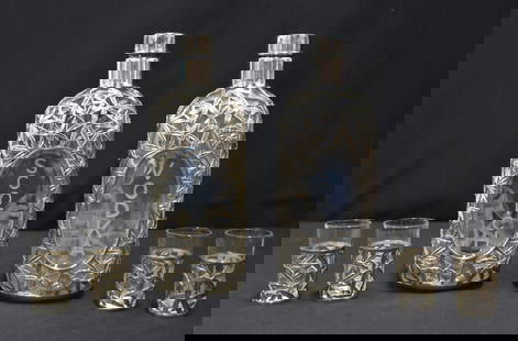 PAIR STERLING OVERLAY DECANTERS & CUPS: (Pr) STERLING SILVER BAMBOO LEAF OVERLAY SCOTCH & VODKA DECANTERS WITH (4) MATCHING STERLING SILVER SHOT CUPS - DECANTER IS 3" x 3" x 9" ; CUPS ARE 2 1/2" (SCOTCH DECANTER HAS CRACK)