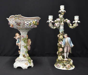 GERMAN PORCELAIN CANDELABRA & PEDESTAL BASKET: GERMAN SITZENDORF PORCELAIN FIGURAL CANDELABRA WITH MAN (SOME MISSING & REPAIRED PIECES) / GERMAN PORCELAIN CHERUBS AROUND TREE FORM PEDESTAL BASKET CENTERPIECE WITH ENCRUSTED FLOWERS (SOME PIECES NEE