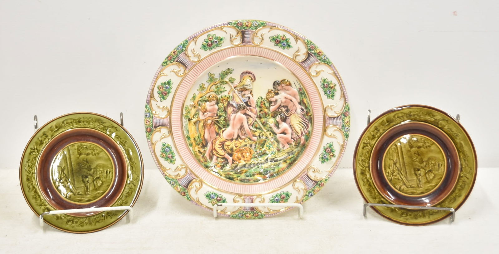 PAIR CHOISY LE ROI FRENCH PLATE & ITALIAN CHARGER: (Pr) CHOISY LE ROI FRENCH MAJOLICA PLATES WITH SCENIC MEDALLIONS ; MARKED H & B CIE ; HAUTIN BOULANGER & CIE - 7 1/2" D / LARGE ITALIAN CAPODIMONTE PORCELAIN CHARGER MARKED GIUDIZIO DI PARIDE , B. CEL