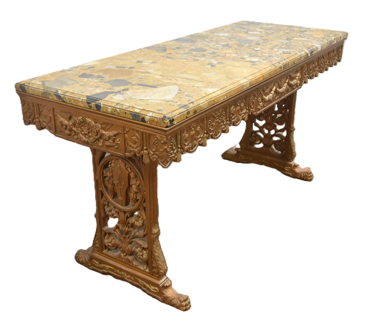 HEAVILY CARVED MARBLE TOP TRESSLE TABLE: HEAVILY CARVED GILTWOOD TRESSLE TABLE WITH CARVED FLOWER GARLANDS , TASSLES & CHERUBS ; WITH FINE ANTIQUE BRECCIA MARBLE TOP - 60" x 23" x