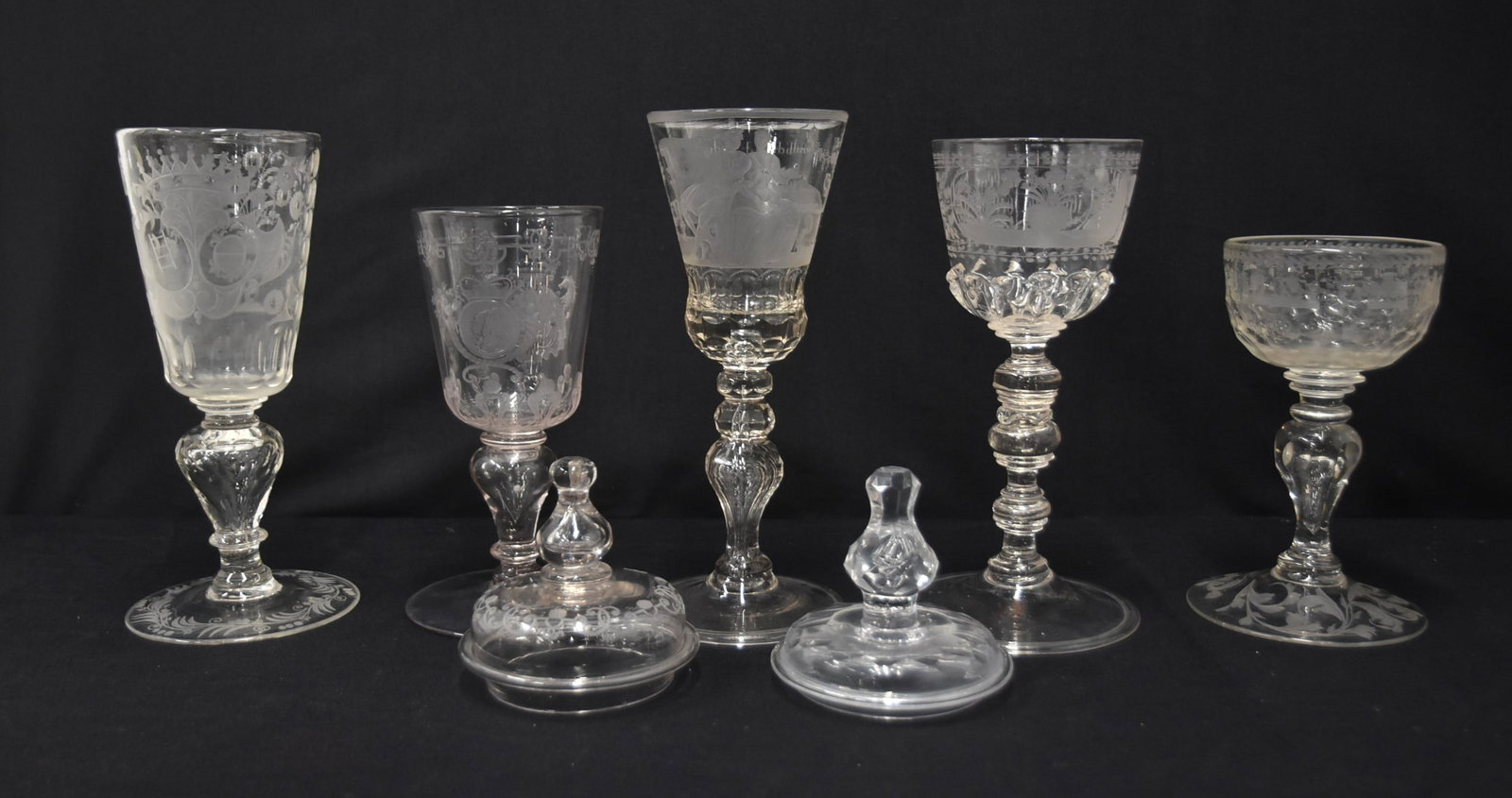 (5) 19th CENTURY ETCHED CHALICE GOBLETS: (5) 19th CENTURY ETCHED CHALICE GOBLETS WITH ETCHED SHEILDS & CROWN , HAVING INSCRIPTIOSN - RANGE FROM 4" x 7" UP TO 4" x 13" (SOME WITH ADDED COVERS )
